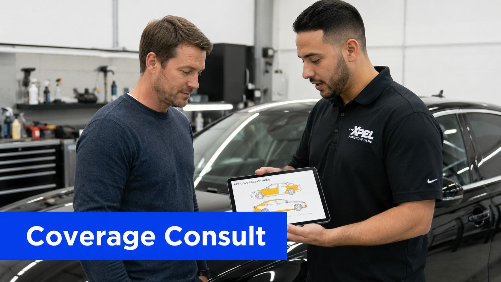 An XPEL technician consults with a customer regarding paint protection film coverage options on a tablet.